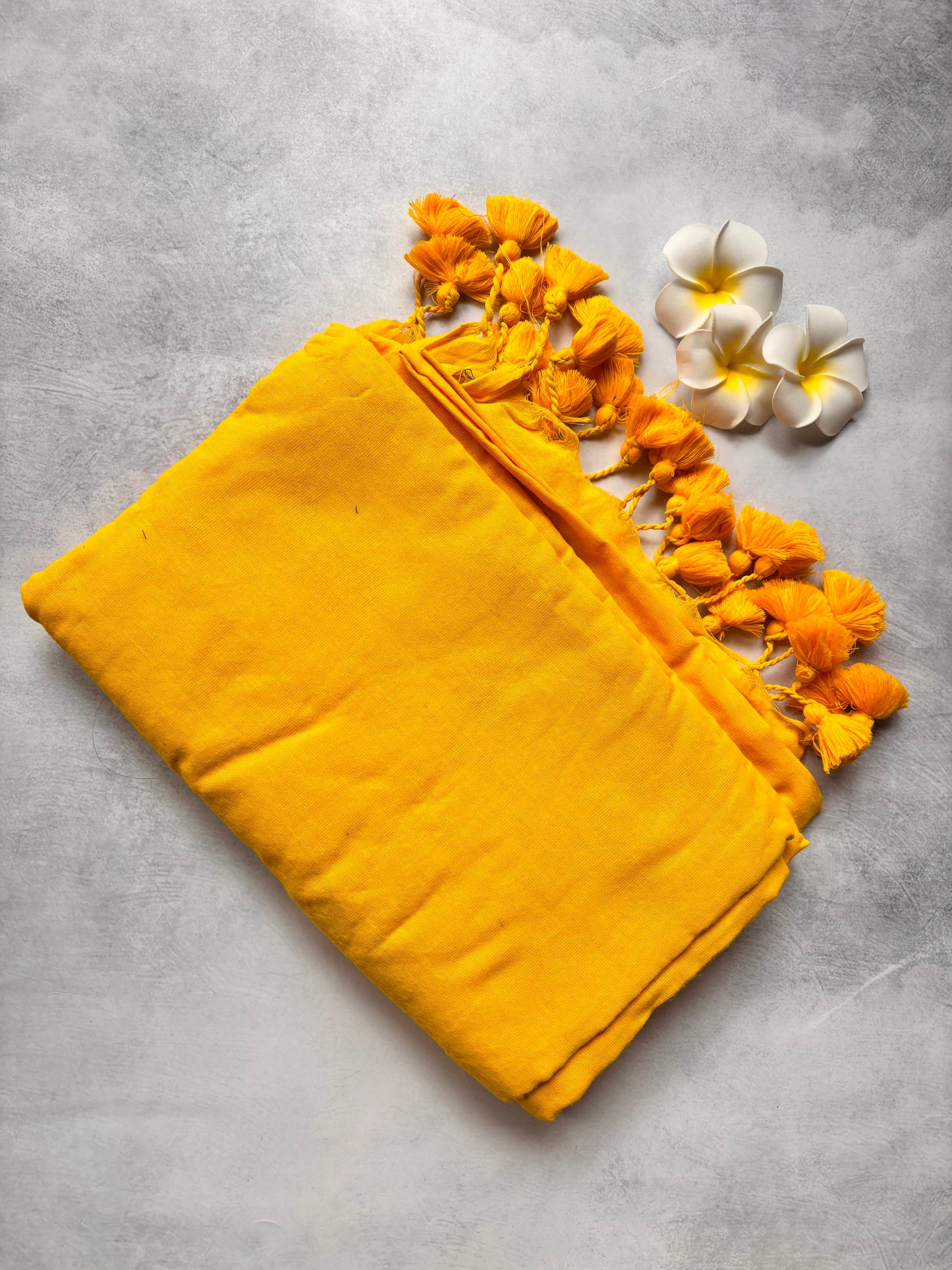 Plain mango Yellow Kadhi Cotton Saree with Yellow Tassels | The Laya Looms