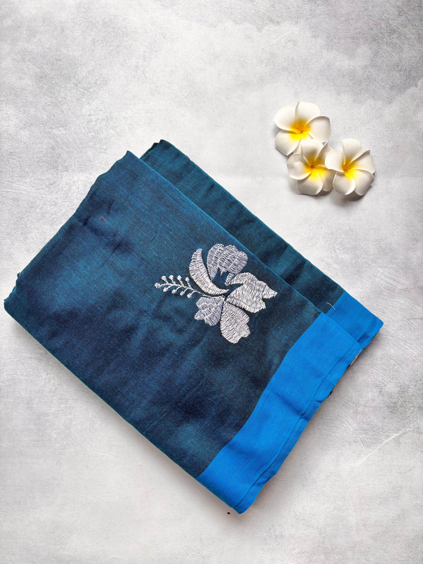 Teal Blue Kadhi Cotton Saree with White Embroidery & Blue Border | The Laya Looms