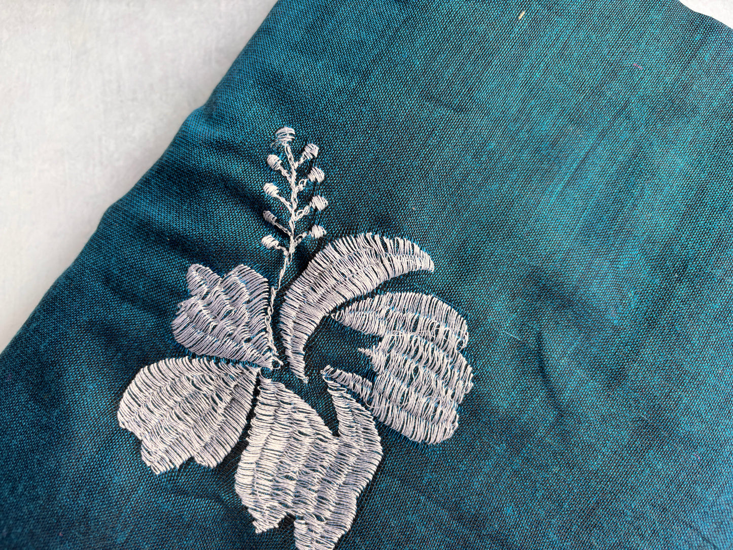 Teal Blue Kadhi Cotton Saree with White Embroidery & Blue Border | The Laya Looms