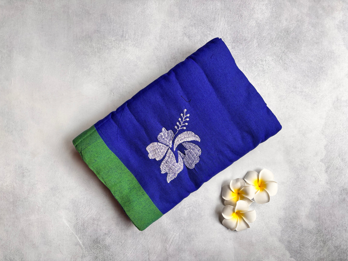 Royal Blue Kadhi Cotton Saree with White Hibiscus Embroidery & Green Border | The Laya Looms
