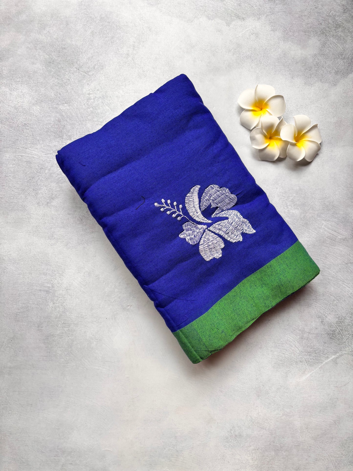 Royal Blue Kadhi Cotton Saree with White Hibiscus Embroidery & Green Border | The Laya Looms