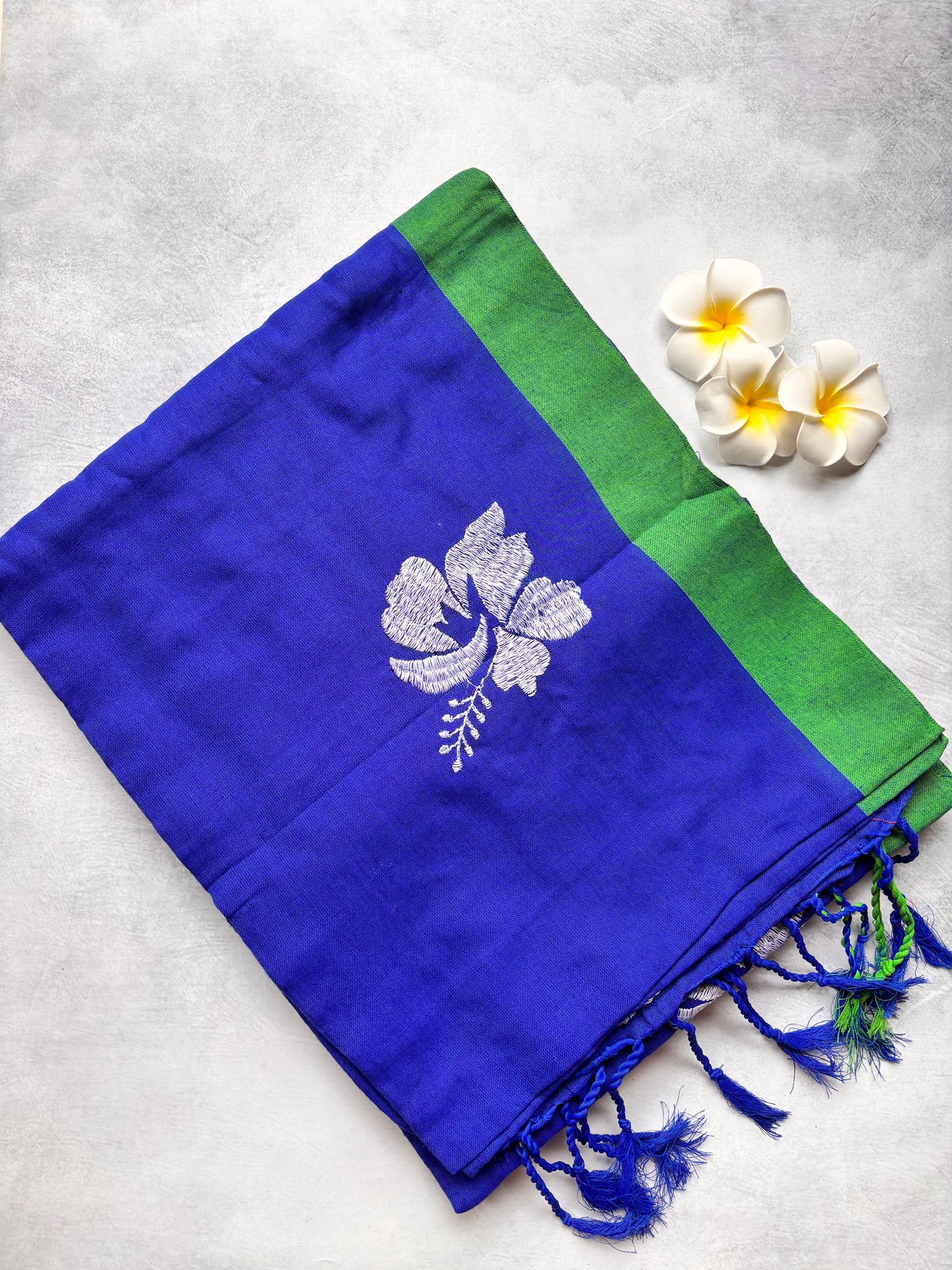 Royal Blue Kadhi Cotton Saree with White Hibiscus Embroidery & Green Border | The Laya Looms