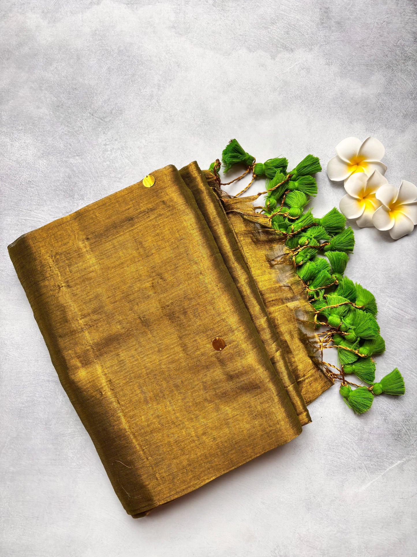 Raga Tissue Kadhi Cotton Saree with Green Tassels & Golden Mirror Work | The Laya Looms