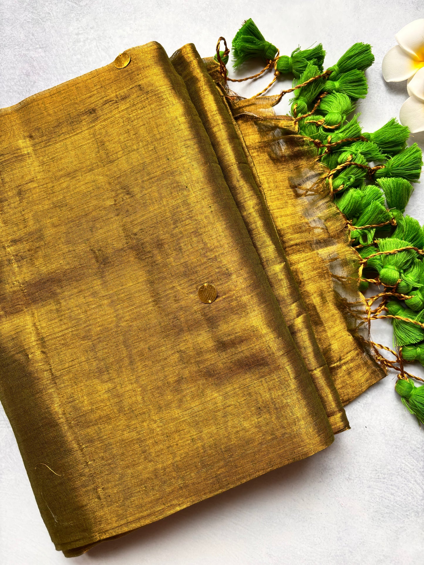 Raga Tissue Kadhi Cotton Saree with Green Tassels & Golden Mirror Work | The Laya Looms