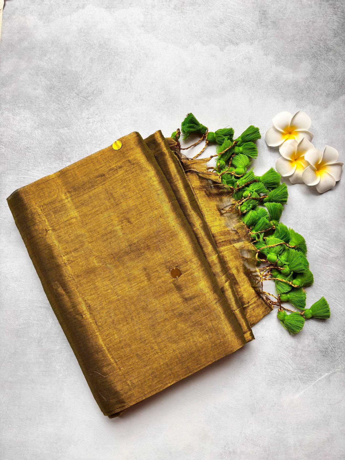 Raga Tissue Kadhi Cotton Saree with Green Tassels & Golden Mirror Work | The Laya Looms
