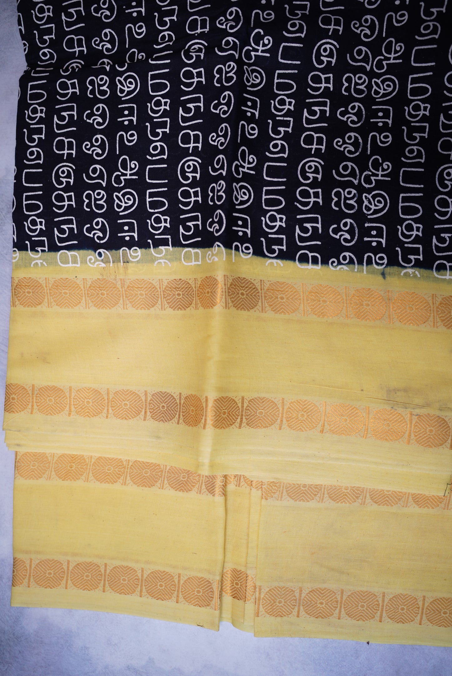 Tamil Letter Printed Sungudi Saree – Black with light Lemon Yellow Border