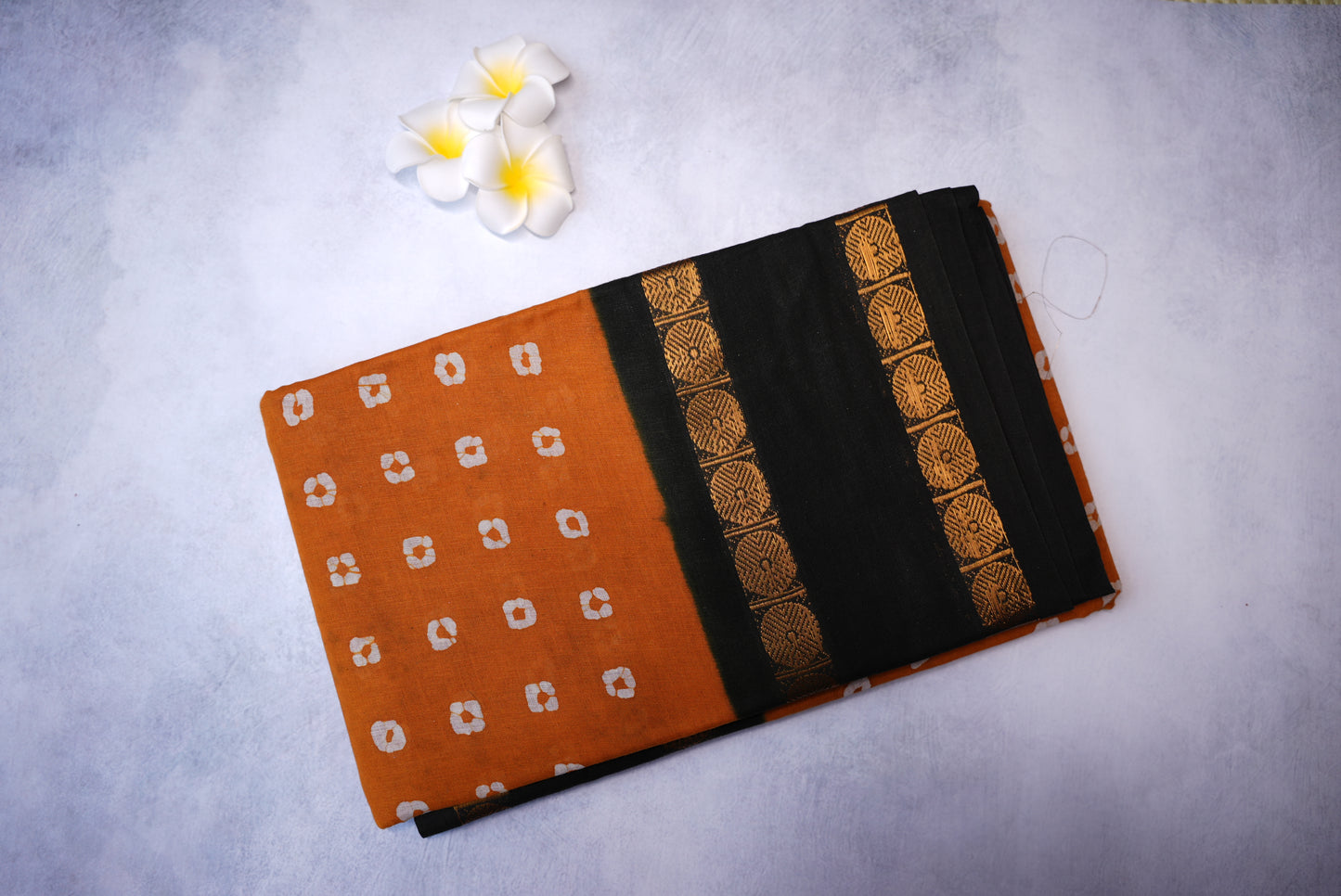 Traditional Batik Print Light Orange Saree with Black Border