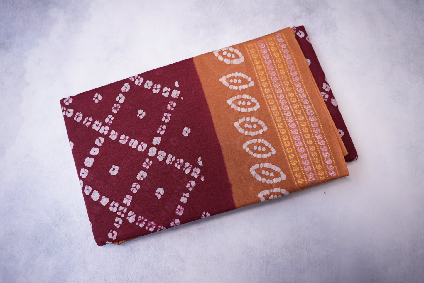 Batik Cross Print Maroon Saree with Orange Border
