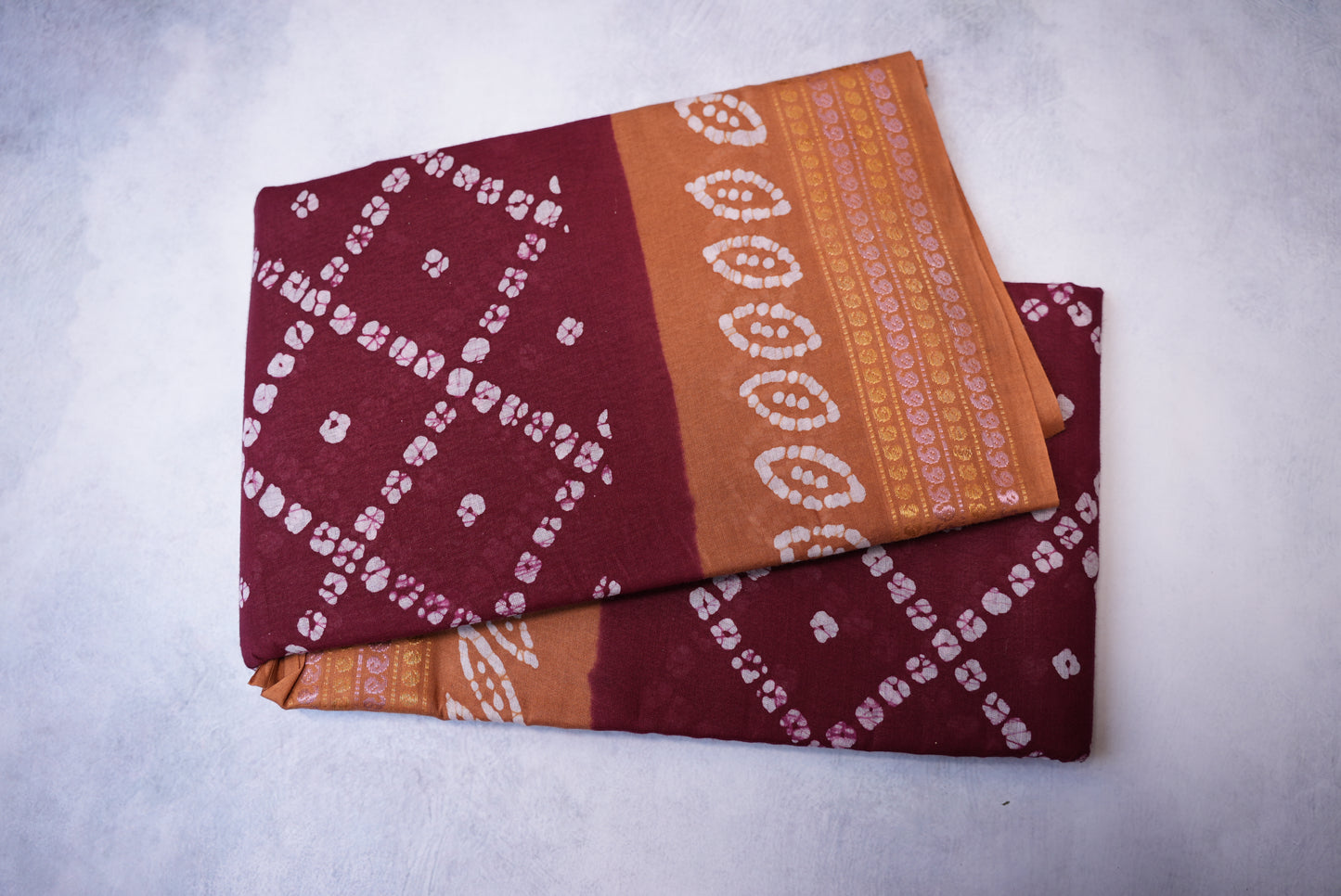 Batik Cross Print Maroon Saree with Orange Border