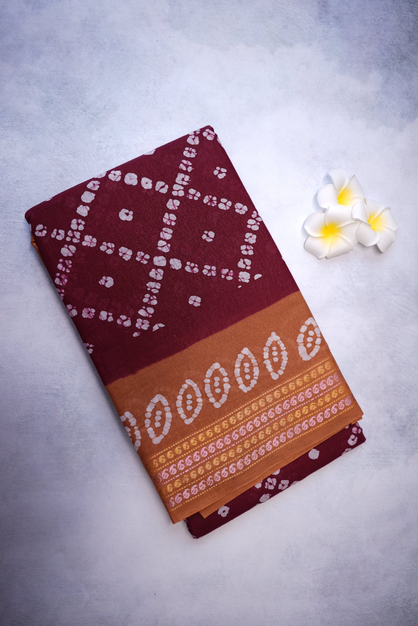 Batik Cross Print Maroon Saree with Orange Border