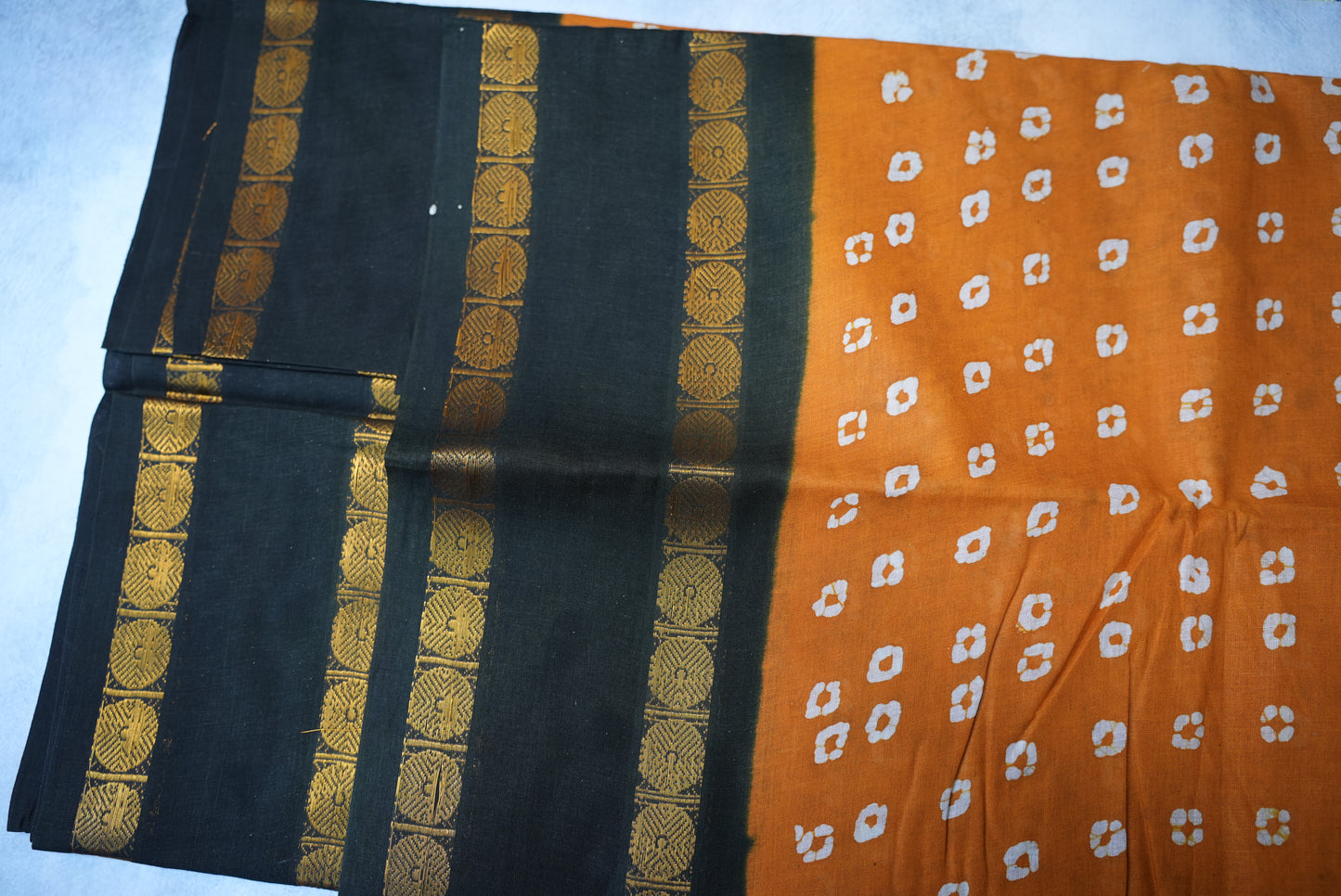 Traditional Batik Print Light Orange Saree with Black Border