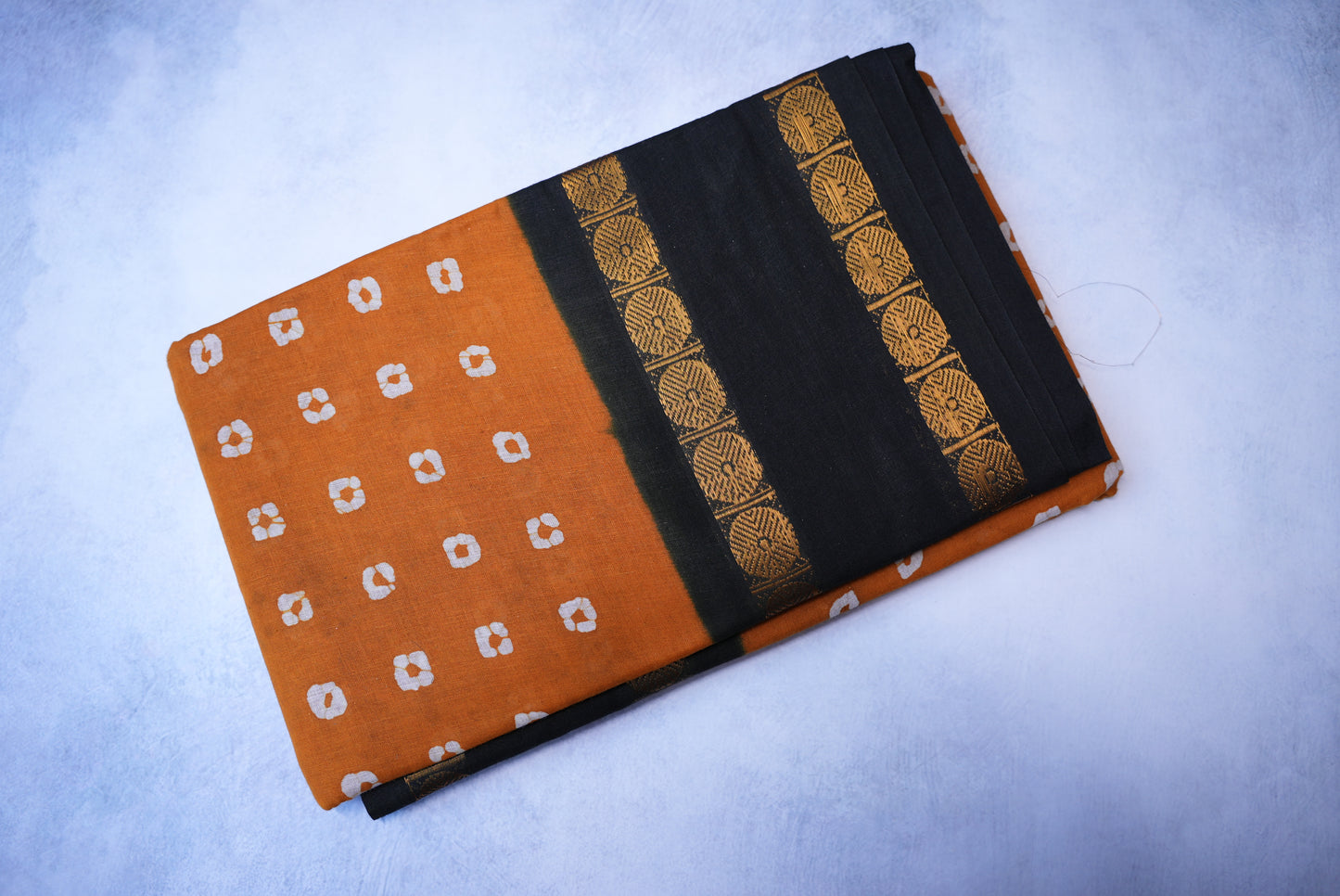Traditional Batik Print Light Orange Saree with Black Border