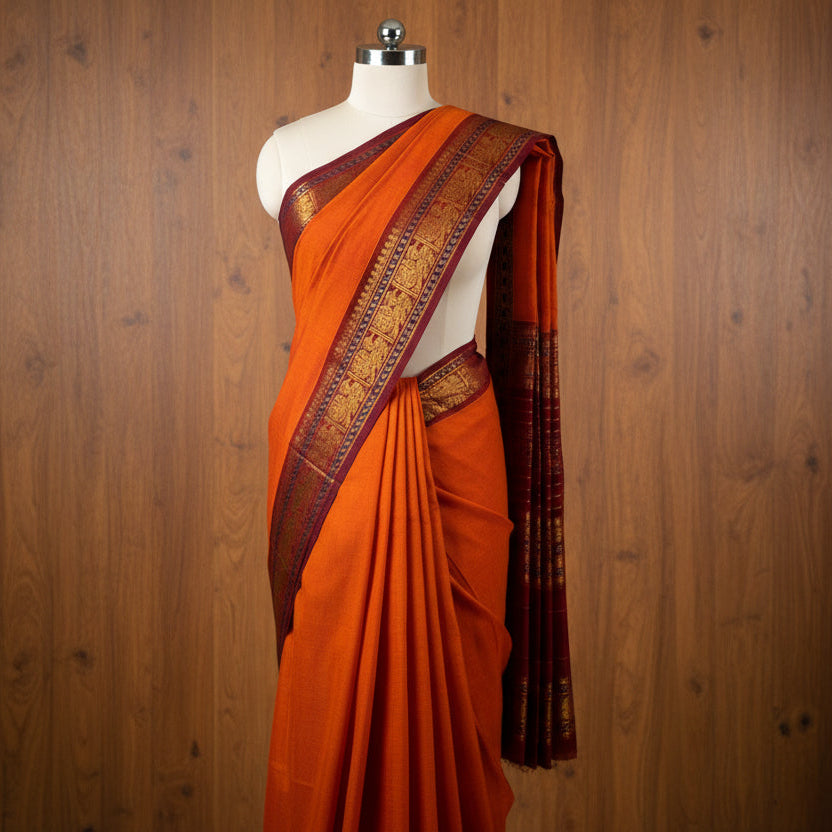 Folded fabric with a pattern on a gray surface with white flowers.