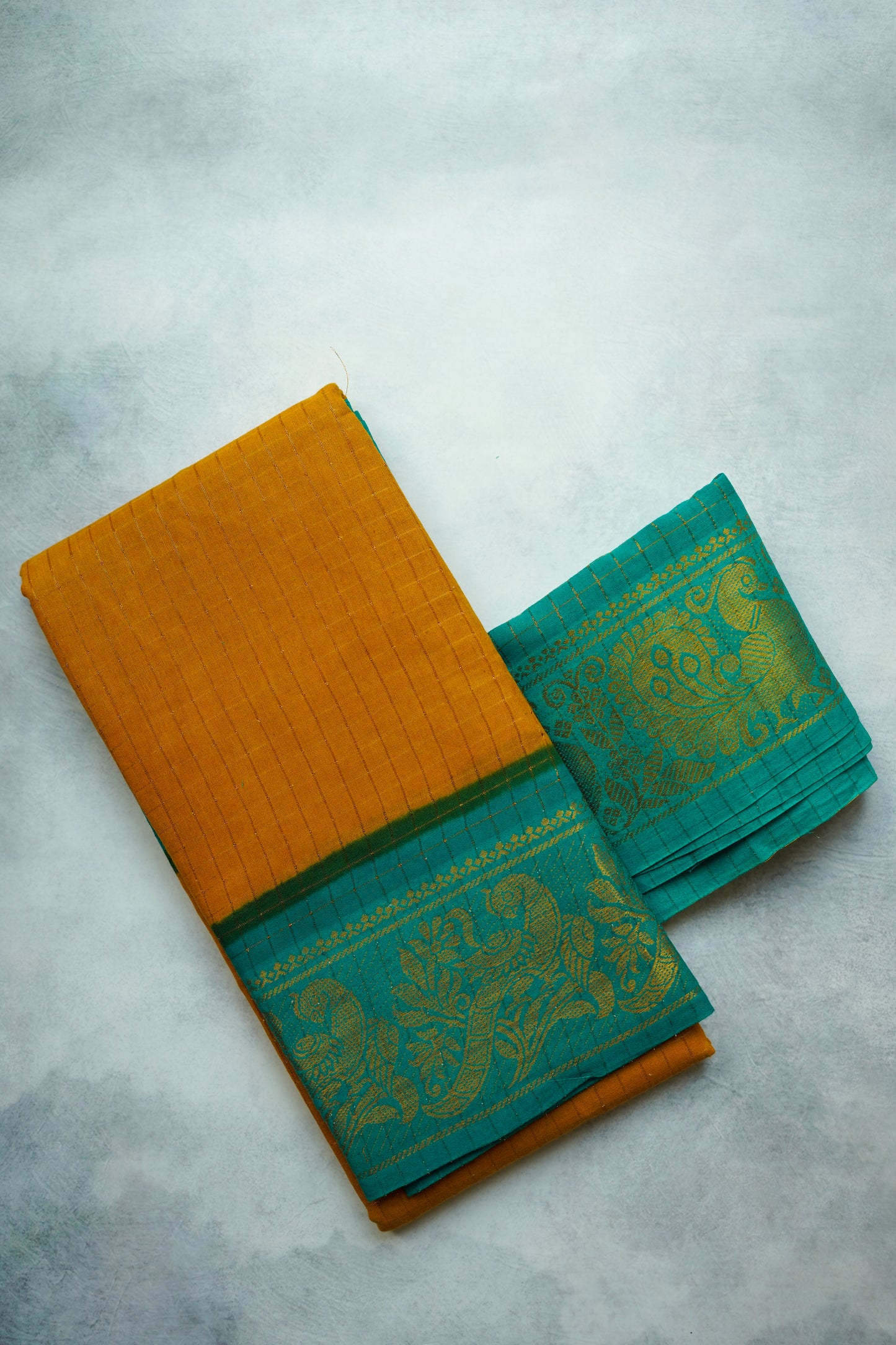 Golden zari checked  Teal Blouse border, and Light Brown sungudi saree