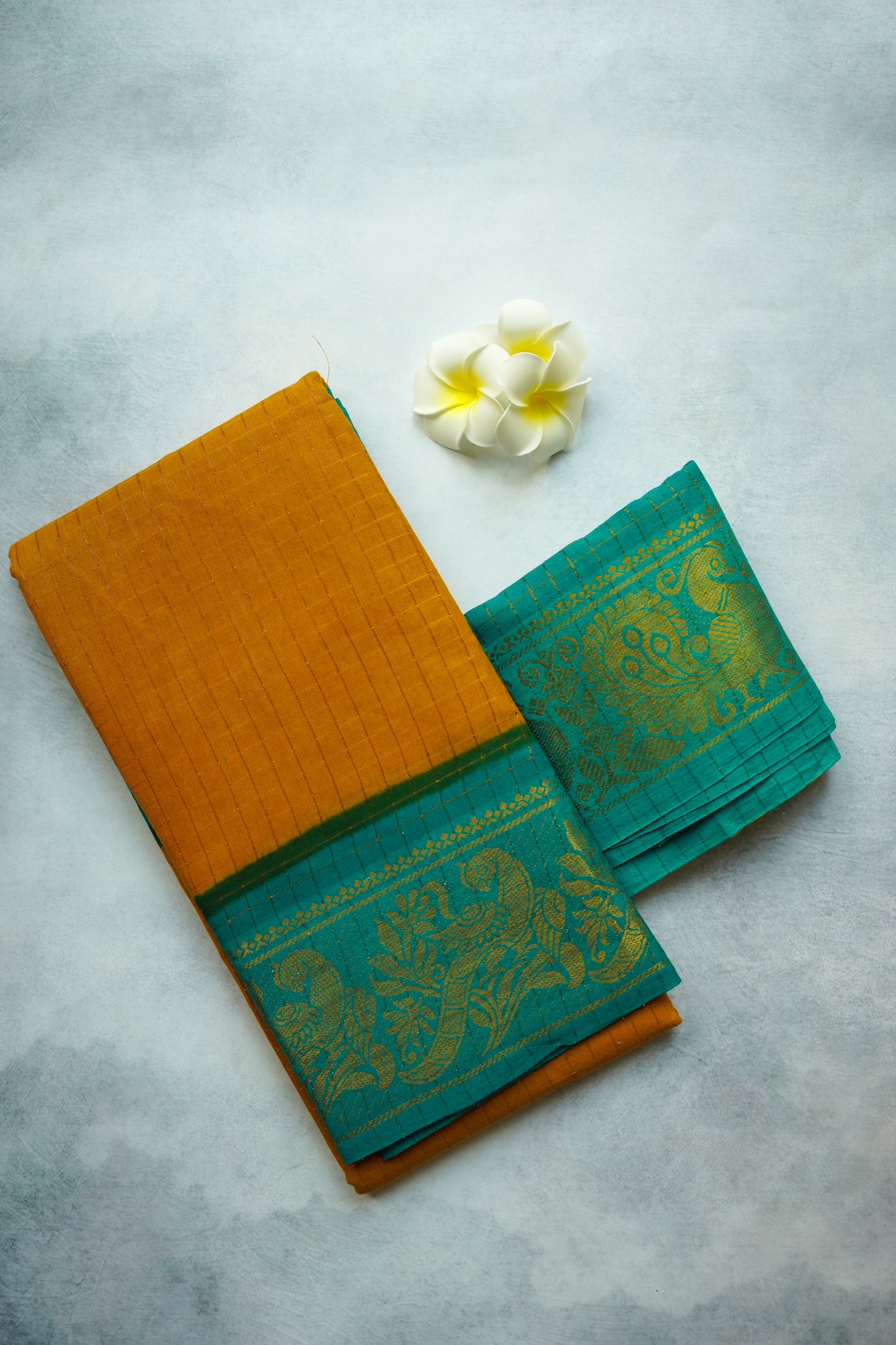 Golden zari checked  Teal Blouse border, and Light Brown sungudi saree