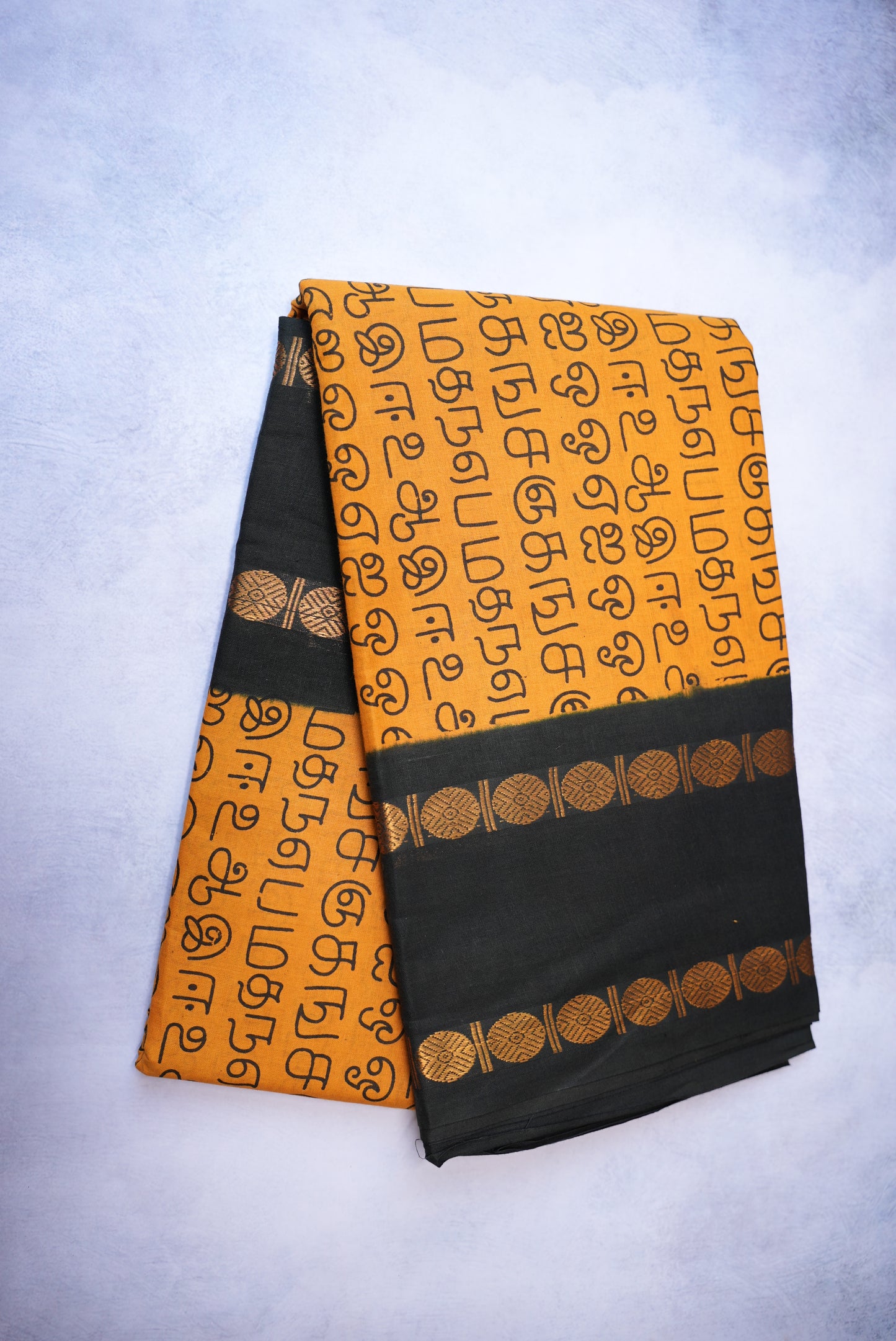 Tamil Letter Printed Sungudi Saree – Dark Sandal Color with Black Border