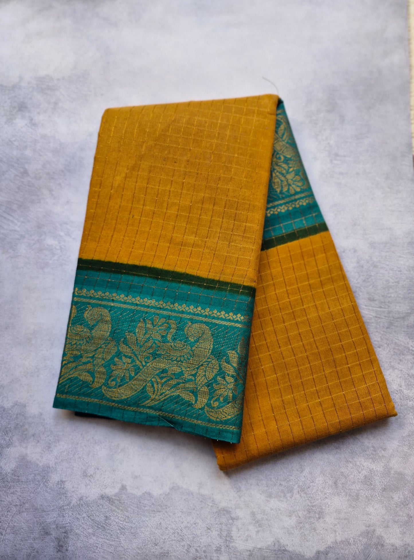 Golden zari checked  Teal Blouse border, and Light Brown sungudi saree