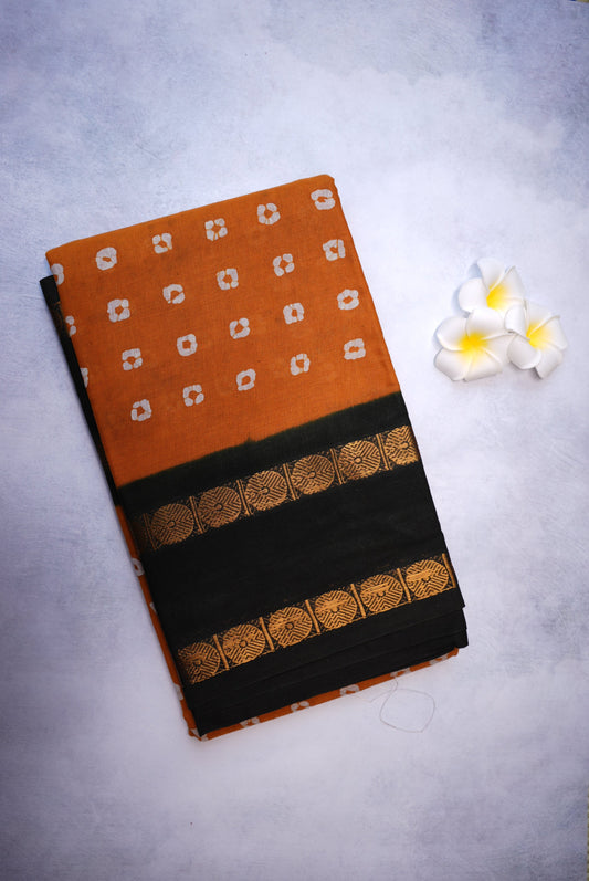 Traditional Batik Print Light Orange Saree with Black Border