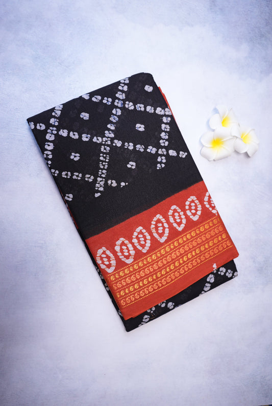 Batik Cross Print Black Saree with Orange Border