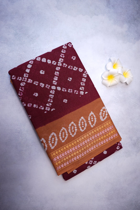 Batik Cross Print Maroon Saree with Orange Border